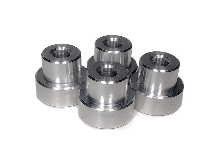 the four aluminum bushings