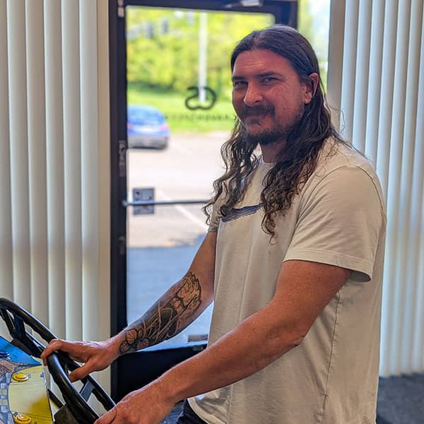 Jason taking a break on our Offroad arcade machine